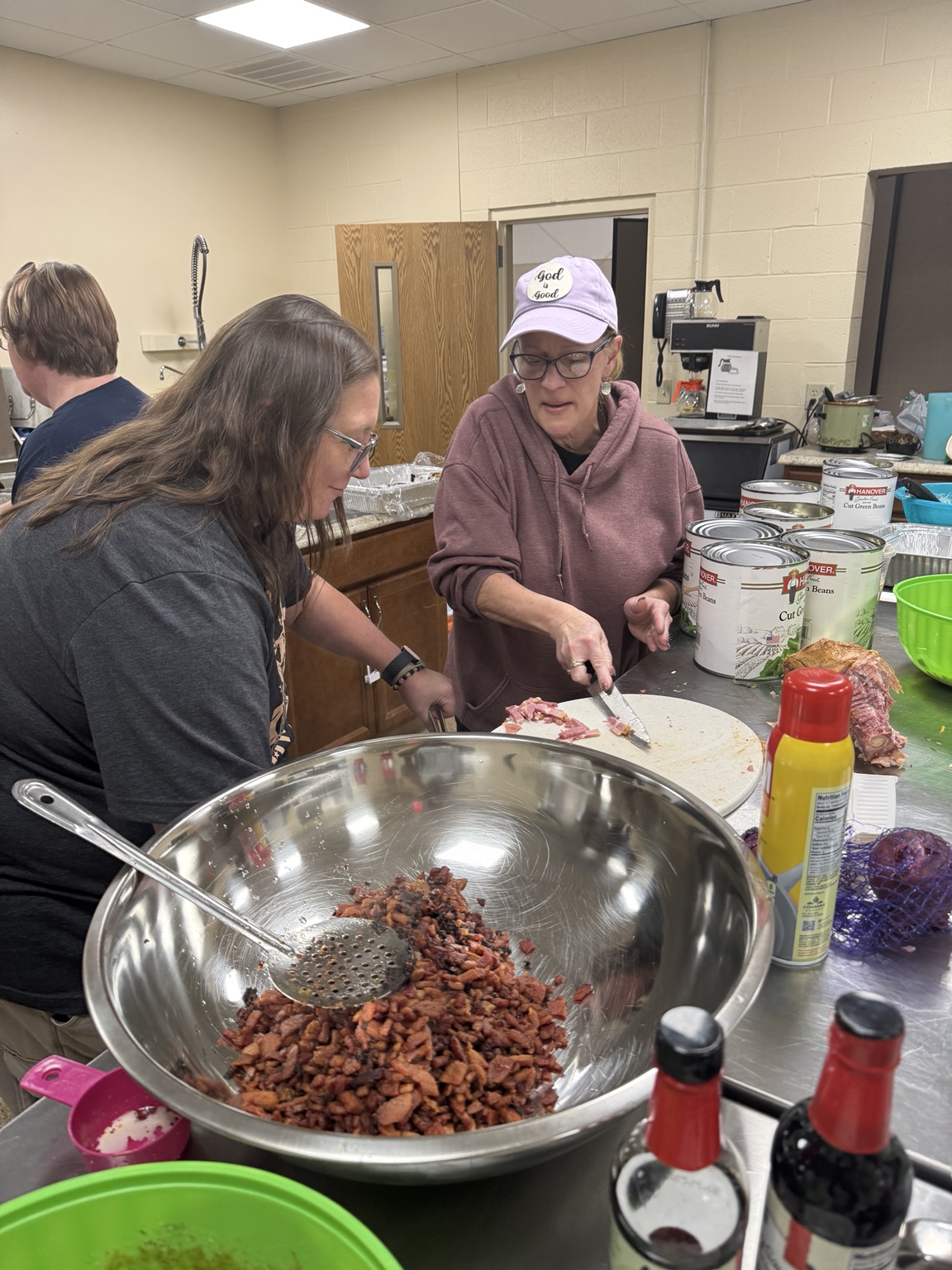 Volunteer preparing side dishes in the kitchen