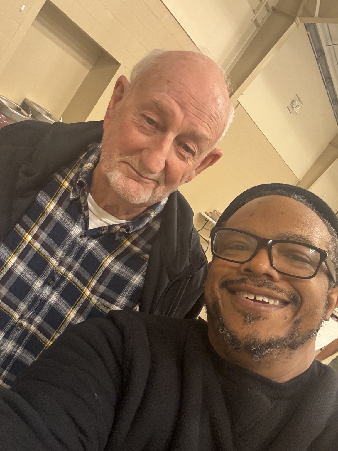 Pastor Brad smiling with a Thanksgiving guest