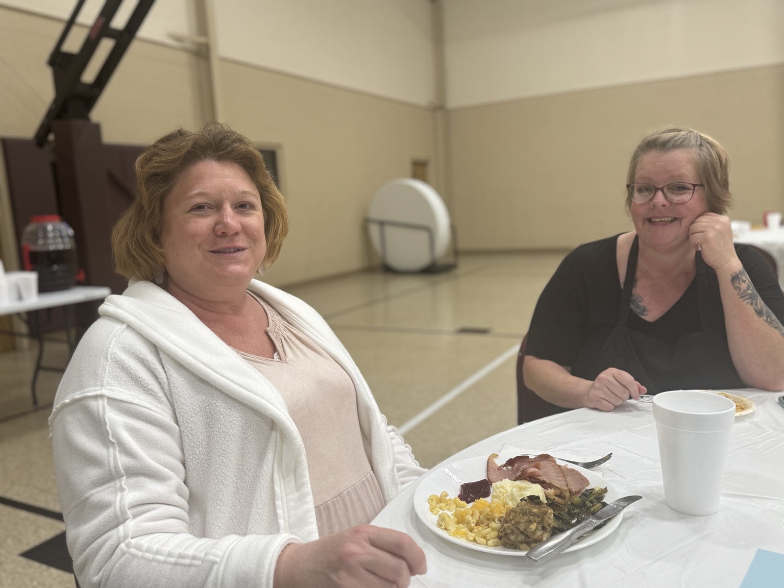 Pastor Brad smiling with a Thanksgiving guest