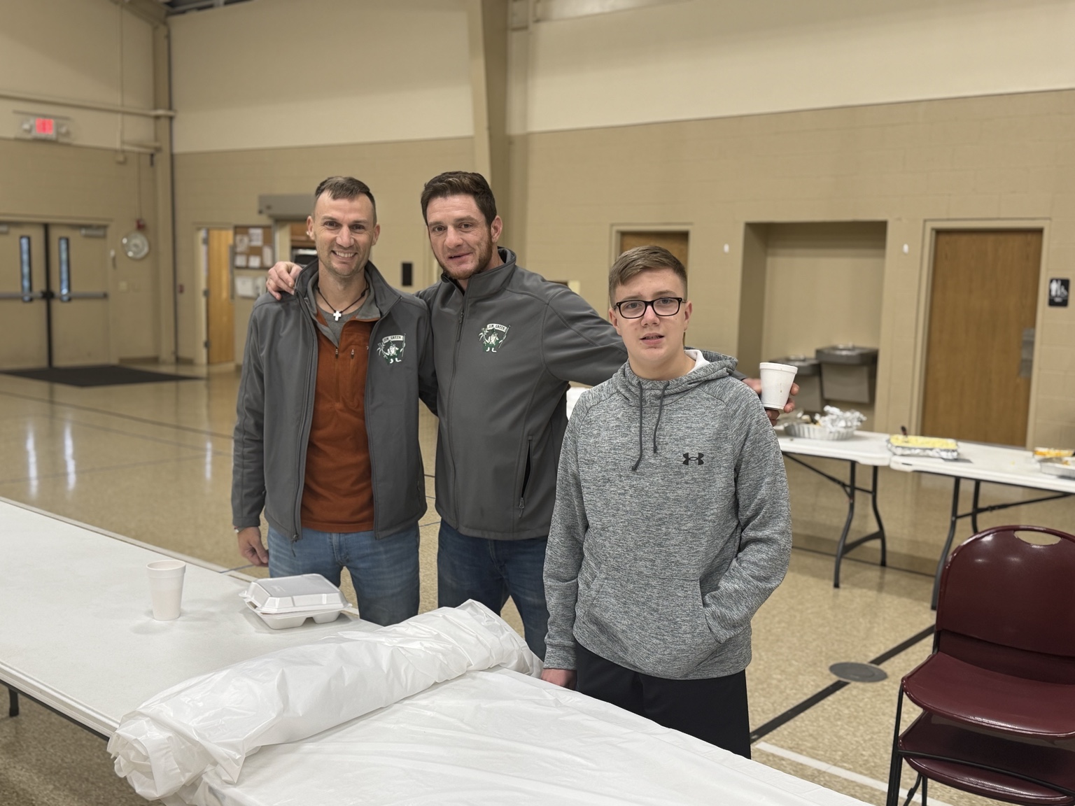 Volunteers standing together in the dining room
