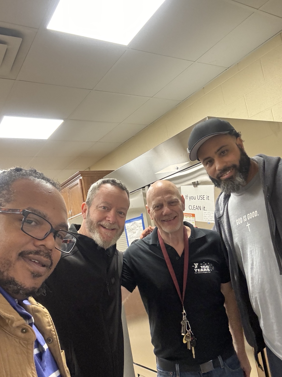 Thanksgiving volunteer team smiling in the kitchen