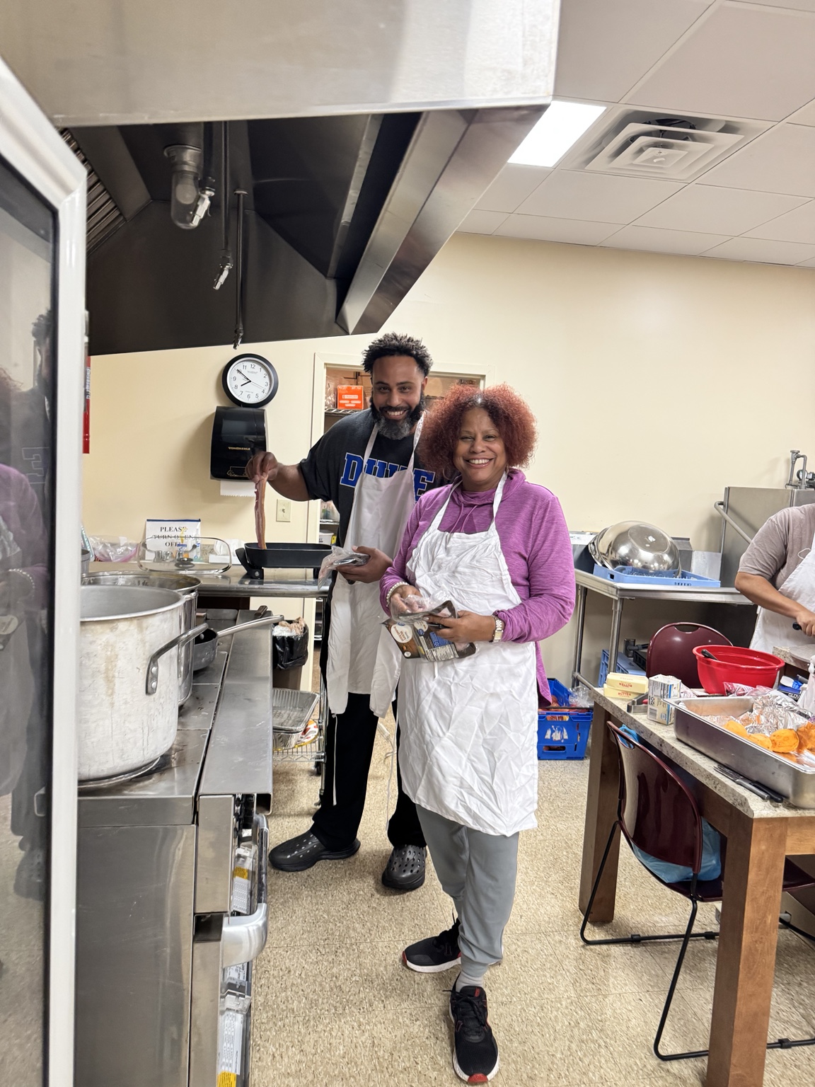 Volunteers working together in the kitchen
