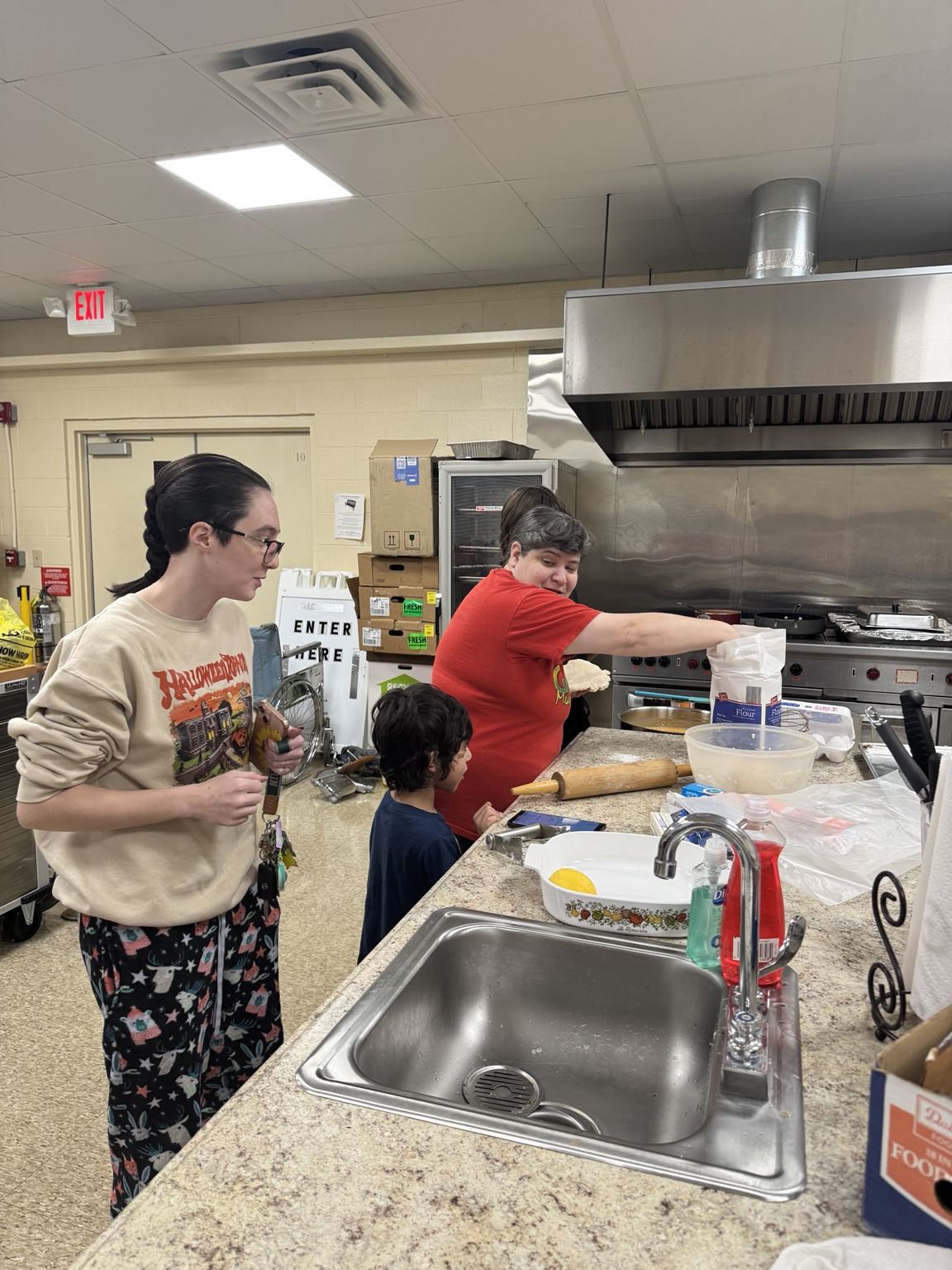 Volunteers coordinating food preparation in the kitchen