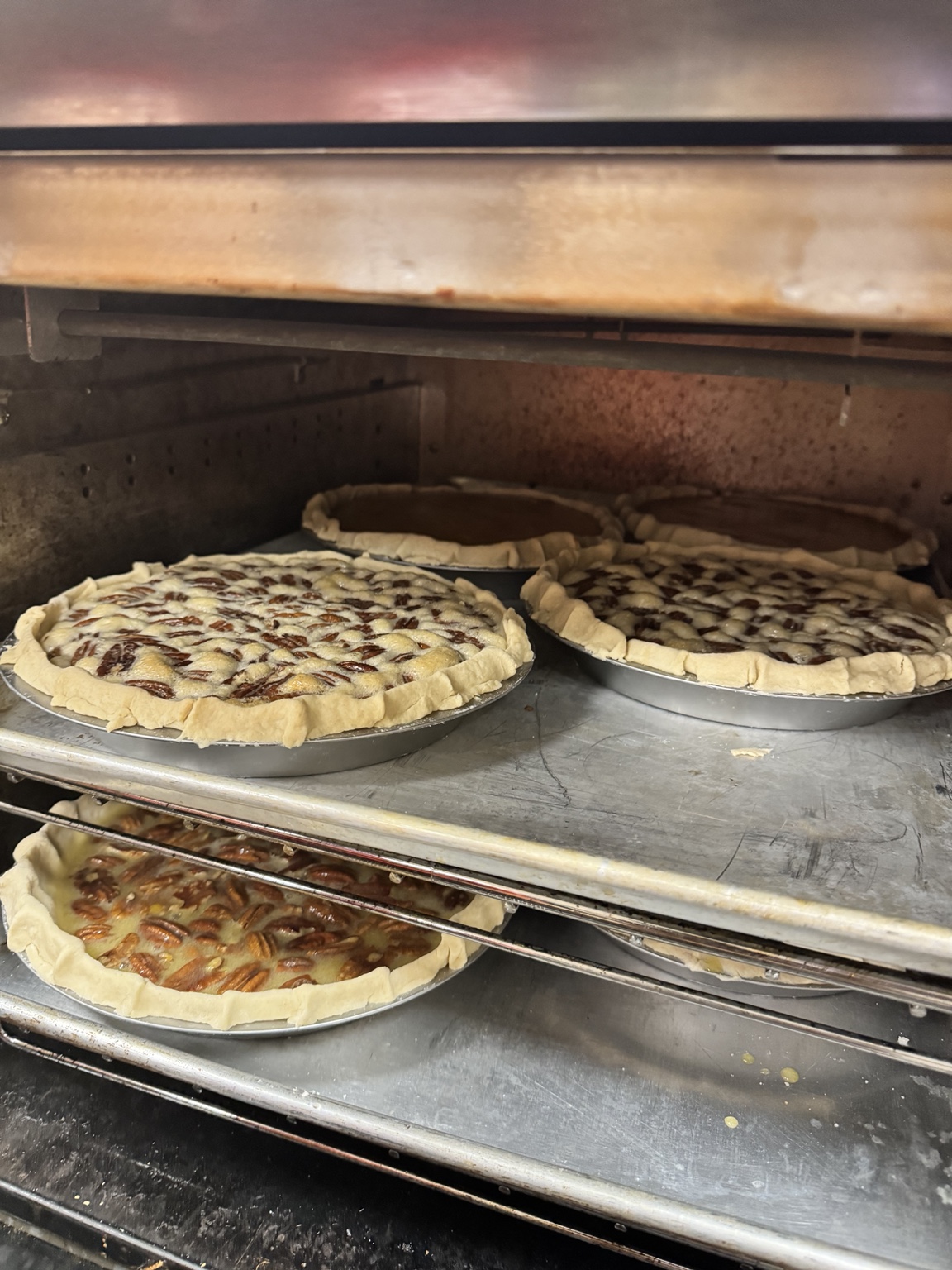 Thanksgiving pies baking in the oven