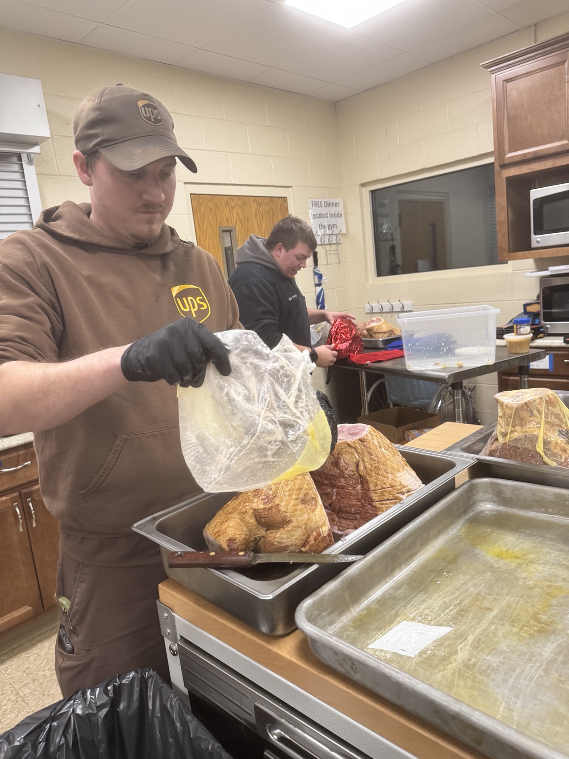 Volunteer preparing Thanksgiving turkey