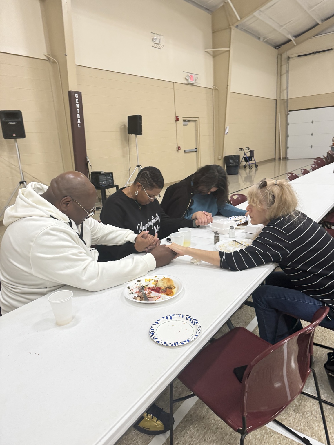 Guests seated at tables during Community Thanksgiving